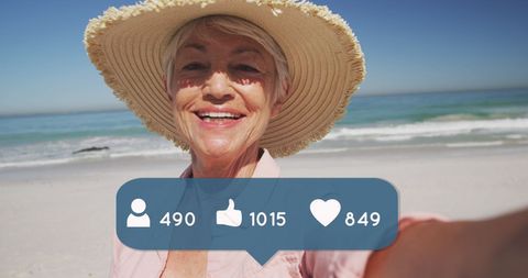 Senior woman enjoying beach time with social media elements