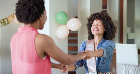 Loving couple embracing at home sharing joyful moment