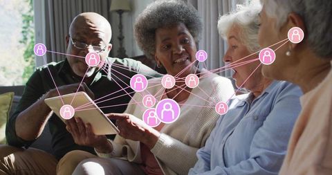 Seniors connecting on tablet with network overlay for digital inclusion and social bonds