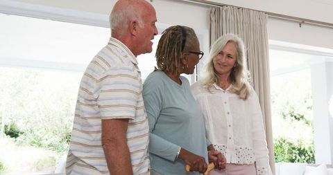 Seniors Engaging in Heartfelt Conversations at Home