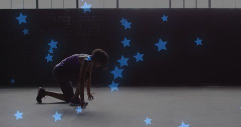 Athletic Woman in Start Position with Floating Blue Stars