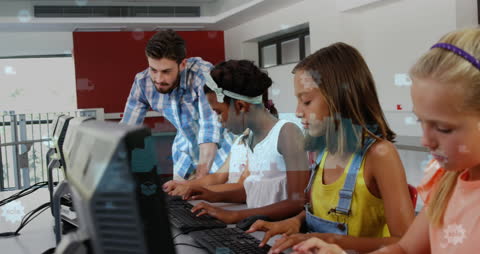 Teacher Assisting Diverse Children in Computer Class