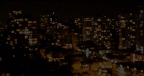Bokeh Effect Over Urban Night Skyline with City Lights
