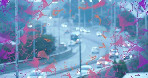 Neon geometric overlay on urban night traffic curving multi-lane road with bokeh lights