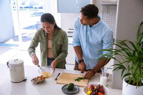 Couple Preparing Fresh Breakfast Together in Modern Kitchen