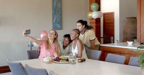 Diverse Friends Having Fun at Home Celebration