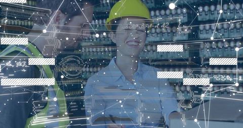 Female engineer inspecting tablet wearing yellow hard hat with ar overlays in automation