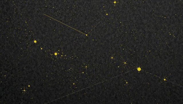 Glowing gold constellation pattern spreading across dark textured background
