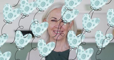 Smiling Senior Woman and Illustrated Heart Balloons for Emotional Conceptual Design