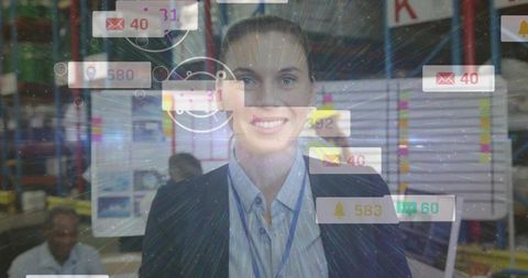 Smiling warehouse manager displaying digital notifications and team planning overlay