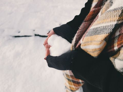 Cozy winter moment: holding fresh snow