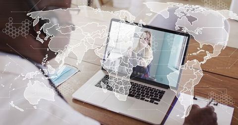 Businessman Joining Virtual Meeting on Laptop with World Map Overlay