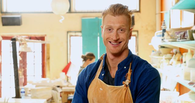 Smiling Potter in Apron in Bright Ceramic Studio - Download Free Stock Images Pikwizard.com