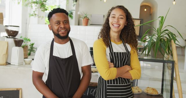 Happy small business owners in bakery wearing aprons - Download Free Stock Images Pikwizard.com