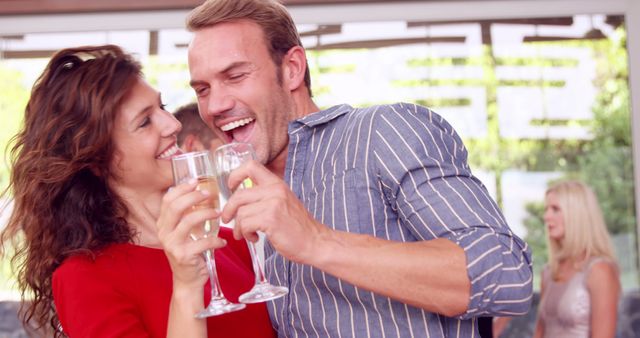 Happy Couple Celebrating with Champagne at Outdoor Party - Download Free Stock Images Pikwizard.com