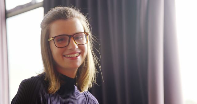 Smiling Young Woman Wearing Glasses in Well-Lit Room - Download Free Stock Images Pikwizard.com