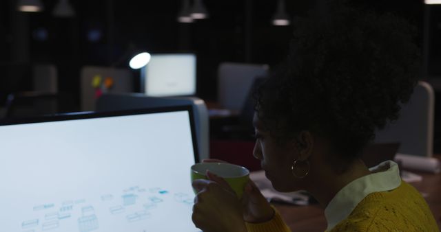 Young Woman Working Late at Office Desk with Computer and Coffee - Download Free Stock Images Pikwizard.com