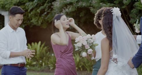 Joyful outdoor wedding gathering and celebration