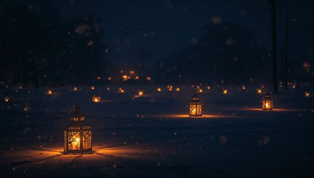 Glowing ornate lanterns casting warm candlelight on snowy night with filigree bokeh