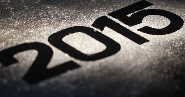 Close-up of 2015 in Bold Black on Glittery Silver Background - Download Free Stock Images Pikwizard.com