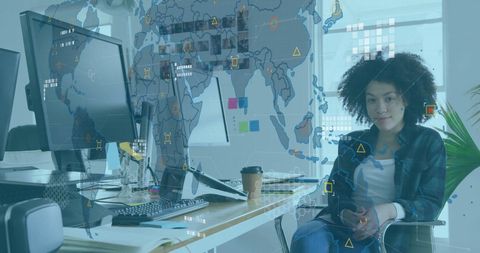 Businesswoman Analyzing Financial Data in Modern Office with Global Map Overlay