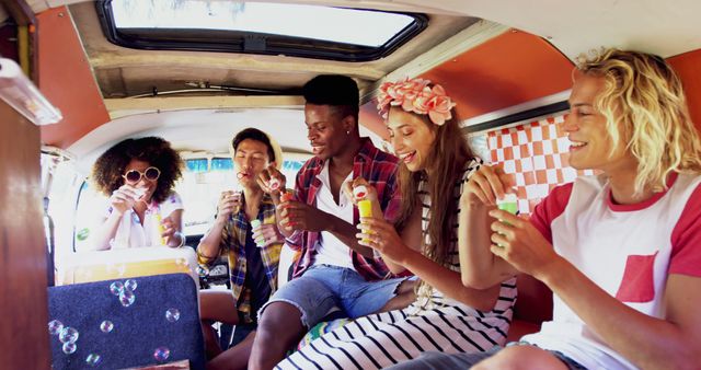 Multiracial Friends Blowing Bubbles on Road Trip Inside Vintage Camper - Download Free Stock Images Pikwizard.com