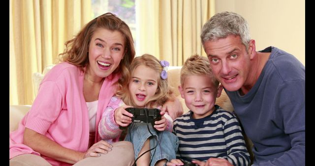 Happy Family Enjoying Video Games Together on Couch - Download Free Stock Images Pikwizard.com