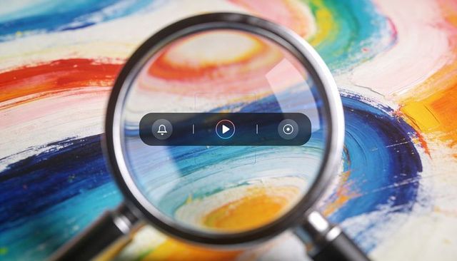 Magnifying Glass Revealing Colorful Brush Textures with Floating Media Controls Overlay
