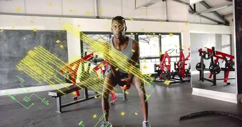 Athlete performing kettlebell squat with AR training overlay in industrial gym