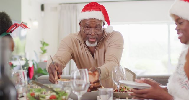 Happy african american family having christmas dinner. Spending quality time with family at christmas concept.