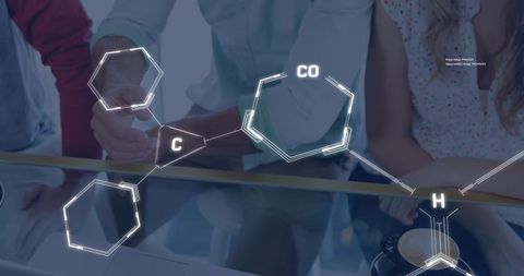 Chemical Formula Overlay with Team Collaborating on Laptop