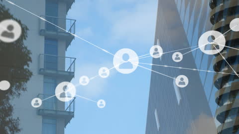 Digital Networking Icons Overlay on Urban Skyscrapers