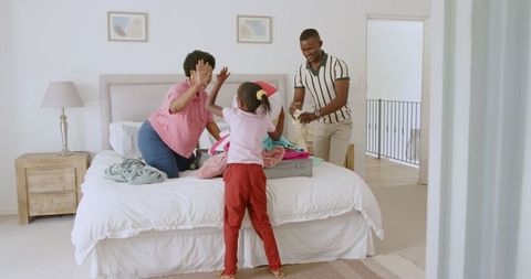 Family Packing Suitcase for Exciting Vacation Getaway Together