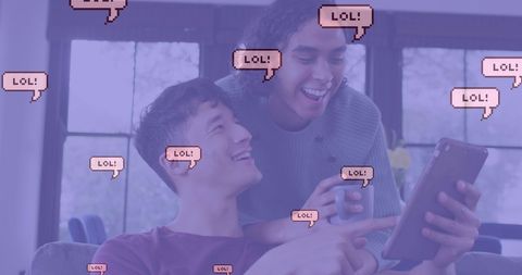 Joyful couple laughing at tablet with embedded lol bubbles