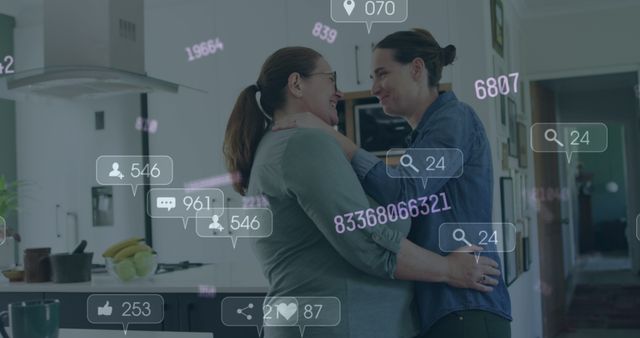 Composite of social media data processing over diverse lesbian couple in kitchen at home. Global social media, gay couple and data processing concept digitally generated image.