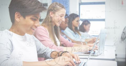 Students Engaged in Digital Learning with Overlaying Math Formulas - Download Free Stock Images Pikwizard.com
