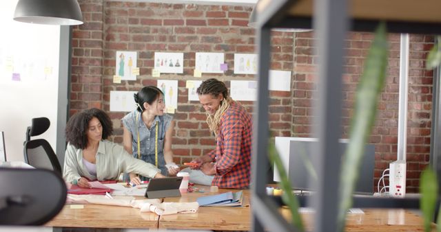 Creative Team Collaborating in Modern Office with Brick Wall - Download Free Stock Images Pikwizard.com