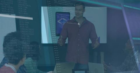 Presenting team collaborating in tech boardroom with code overlay and glass reflections