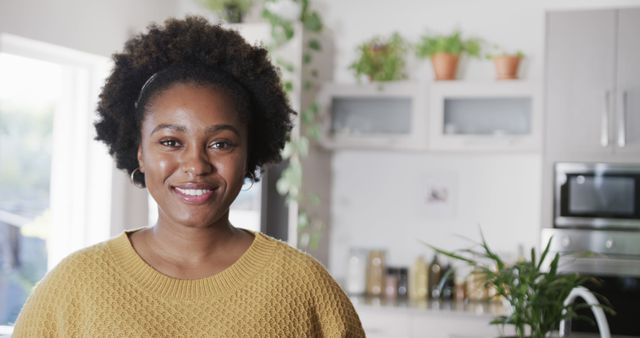 Smiling African American Woman in Modern Kitchen - Download Free Stock Images Pikwizard.com