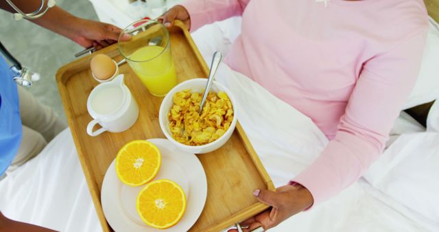 Helpful Nurse Bringing Breakfast to Patient in Hospital Bed - Download Free Stock Images Pikwizard.com