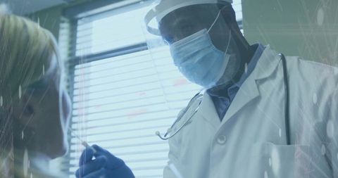 Doctor performing nasal swab test in clinical exam room