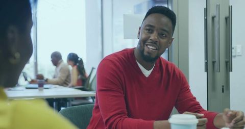 Man engaged in professional discussion in office lounge