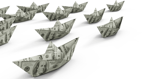 Paper boats made of money on transparent background