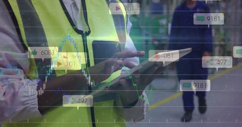 Industry Worker Using Tablet with Data Overlays in Modern Warehouse