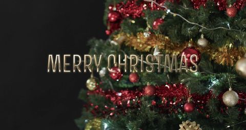 Festive Merry Christmas Text on Decorated Tree - Download Free Stock Images Pikwizard.com