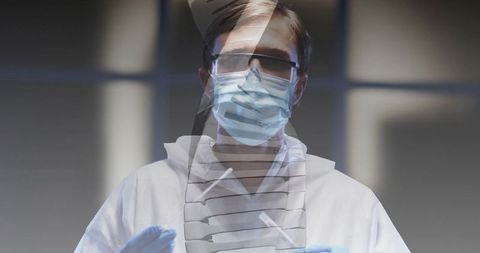 Healthcare worker holding sterile swabs wearing full ppe and goggles presenting clinical lab overlay