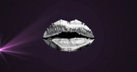 Metallic silver lips reflecting neon violet light on deep purple