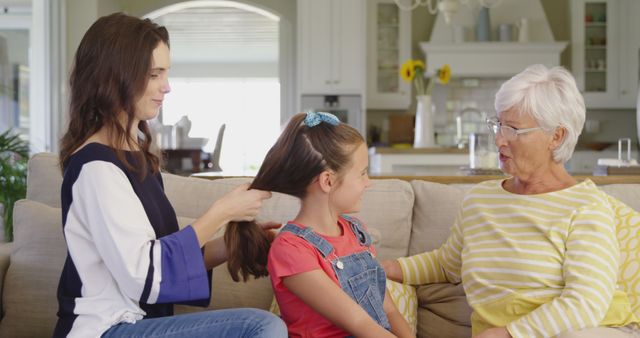 Generations Bonding, Mother Braiding Daughter’s Hair While Grandmother Watches - Download Free Stock Images Pikwizard.com