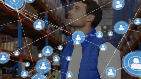 Man Analyzing Network Connections in Warehouse with Data Icons