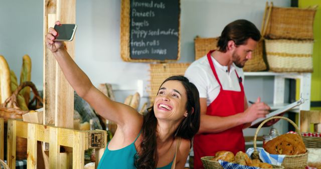 Smiling Woman Takes Selfie at Artisan Bakery - Download Free Stock Images Pikwizard.com